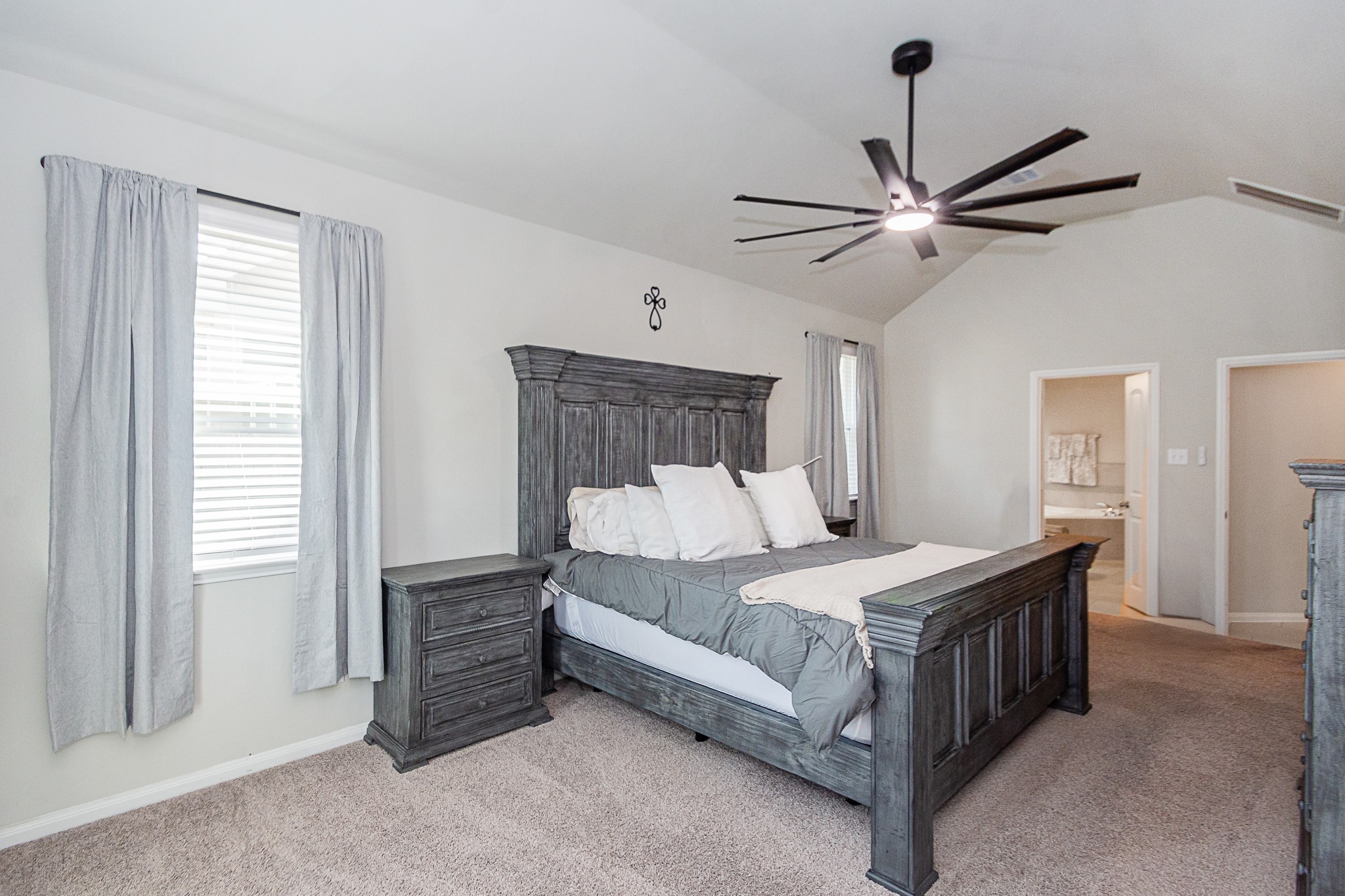 1842 Kenley Way Alvin, TX 77511 - Photo 14 of 44 a bedroom with a bed chandelier and a window