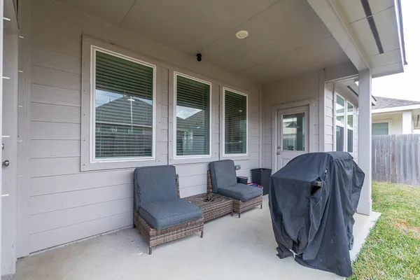 a living room with furniture and windows