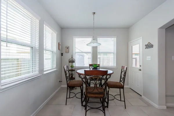a view of a dining room with furniture window and outside view