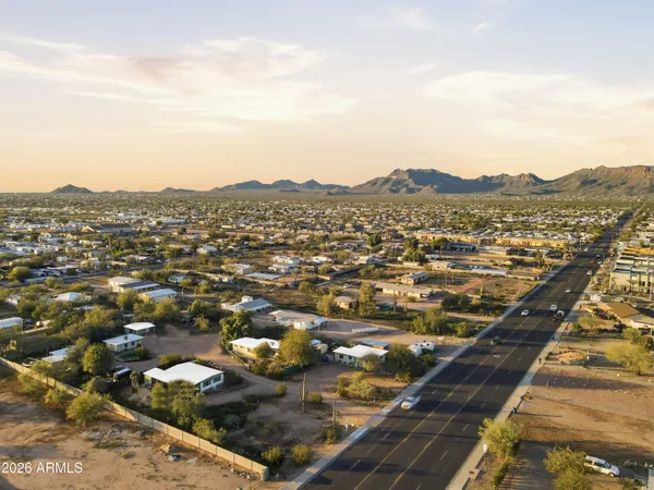 an aerial view of residential houses with outdoor space