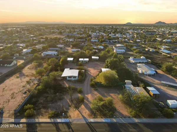 an aerial view of residential houses with outdoor space