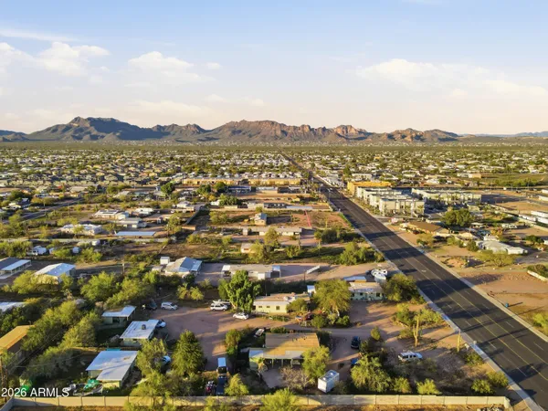 an aerial view of residential building and car parked