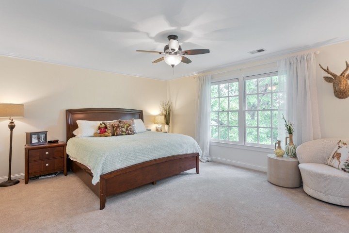 308 Monticello Road Franklin, TN 37064 - Photo 13 of 24 a spacious bedroom with a bed and a chandelier