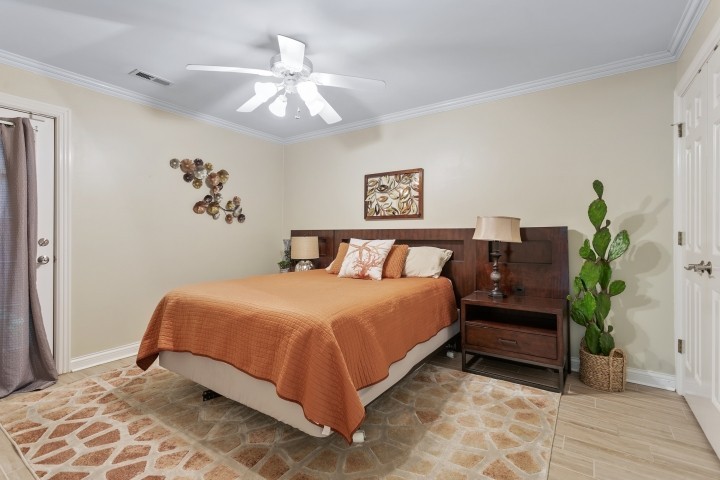 308 Monticello Road Franklin, TN 37064 - Photo 20 of 24 a bedroom with a large bed and a chandelier