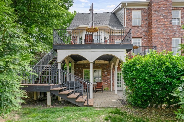 308 Monticello Road Franklin, TN 37064 - Photo 22 of 24 a view of a house with brick walls and a small yard