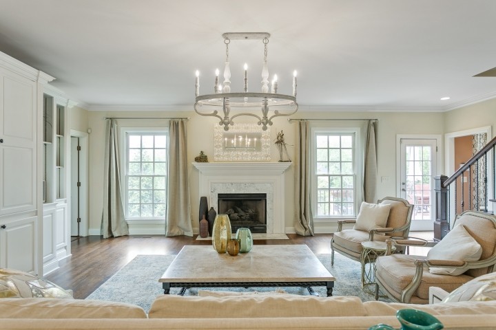 308 Monticello Road Franklin, TN 37064 - Photo 9 of 24 a living room with furniture chandelier and a fireplace