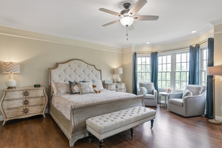 308 Monticello Road Franklin, TN 37064 - Photo 10 of 24 a bedroom with a bed couch and a large window with wooden floor