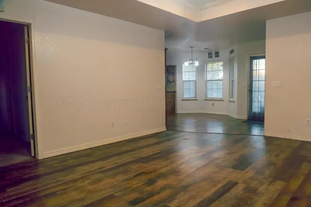 a view of livingroom with window and hardwood floor