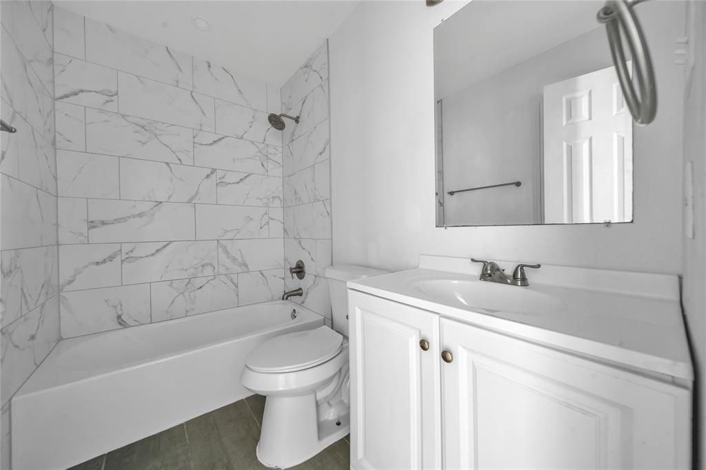 901 Johnson Street Terrell, TX 75160 - Photo 18 of 21 a bathroom with a sink toilet and shower