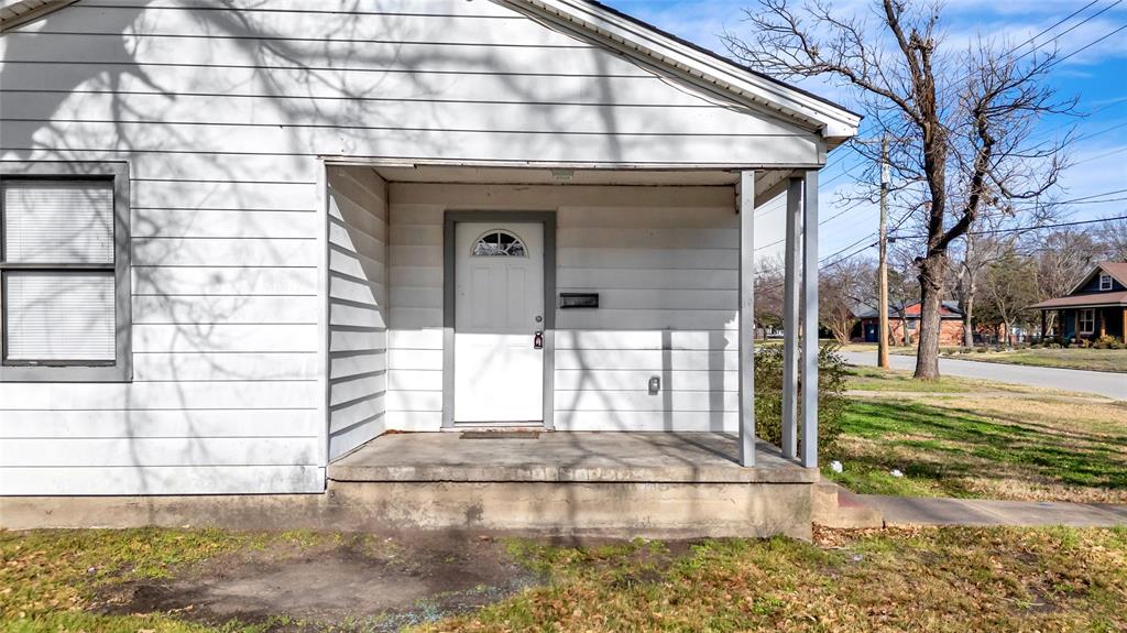 901 Johnson Street Terrell, TX 75160 - Photo 8 of 21 a view of a brick house with a large windows