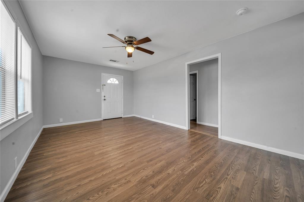 901 Johnson Street Terrell, TX 75160 - Photo 10 of 21 a view of empty room with wooden floor and fan