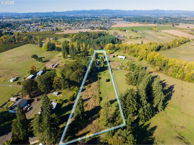 a view of a swimming pool with a table and chairs