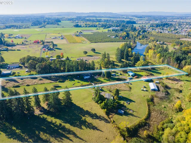an aerial view of a house with a lake view