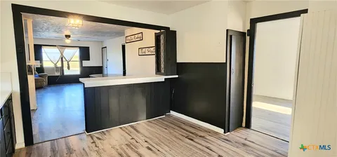 a bedroom with a bed and a mirror