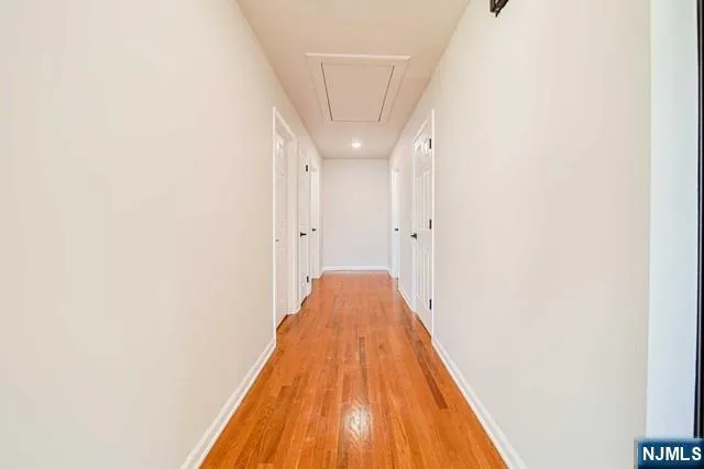 a view of a hallway with staircase