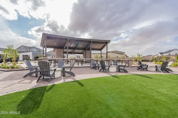 a view of a yard with table and chairs
