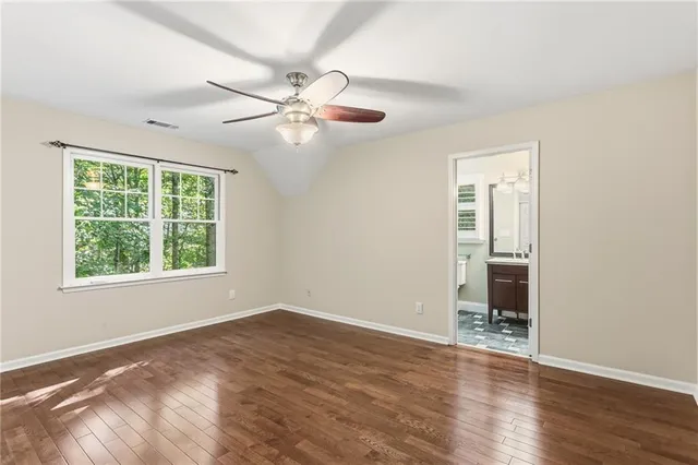 a balcony with wooden floor and outdoor space