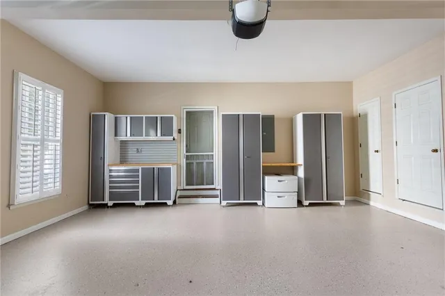 a view of a house with a small yard and wooden floor