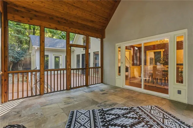 a view of a house with a small yard and a garden