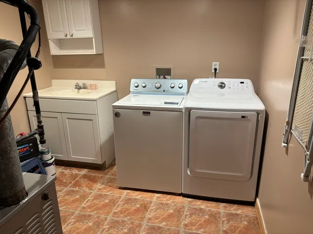 a utility room with dryer and washer