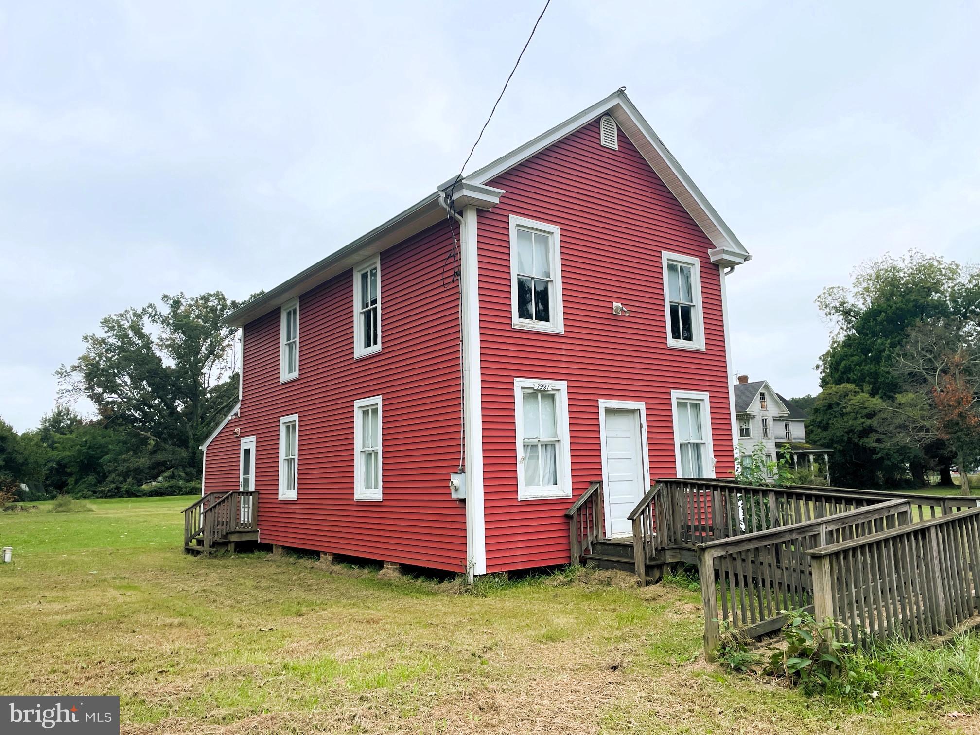 7983 Bozman Neavitt Road Bozman, MD 21612 - Photo 1 of 5 a house that has a big yard in front of it