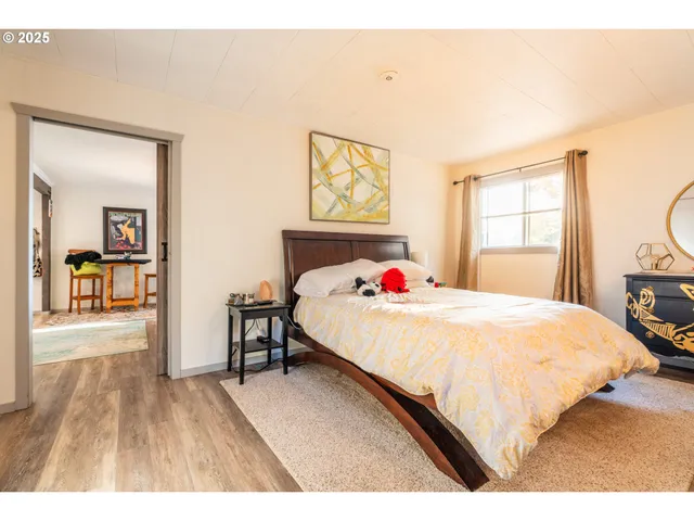 a bedroom with a bed and a table