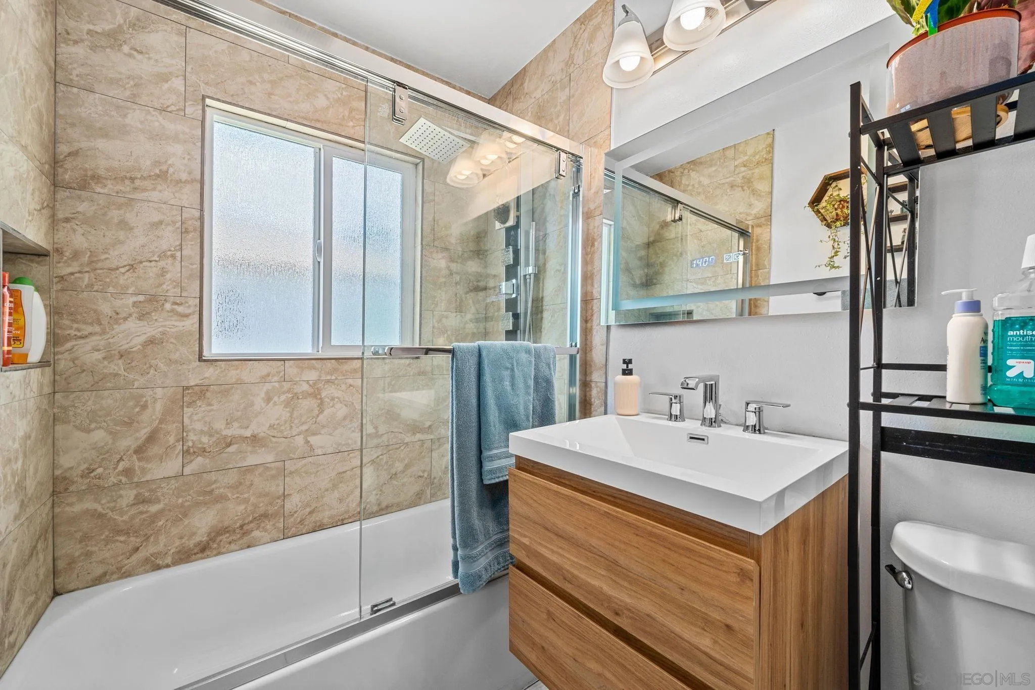 4544 Edgewood Place Riverside, CA 92506 - Photo 13 of 29 a bathroom with a sink and a mirror