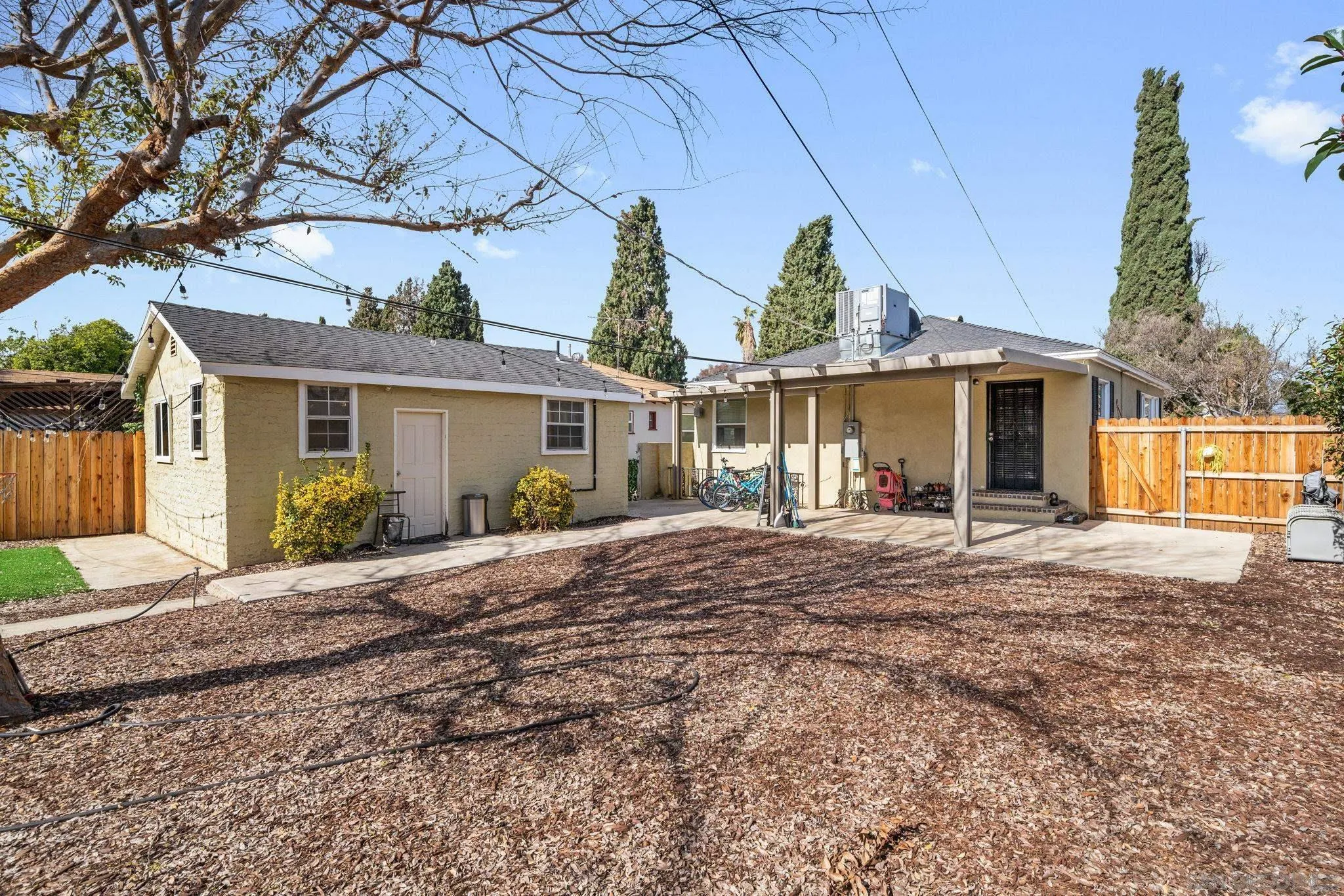 4544 Edgewood Place Riverside, CA 92506 - Photo 18 of 29 a front view of a house with a garden and patio