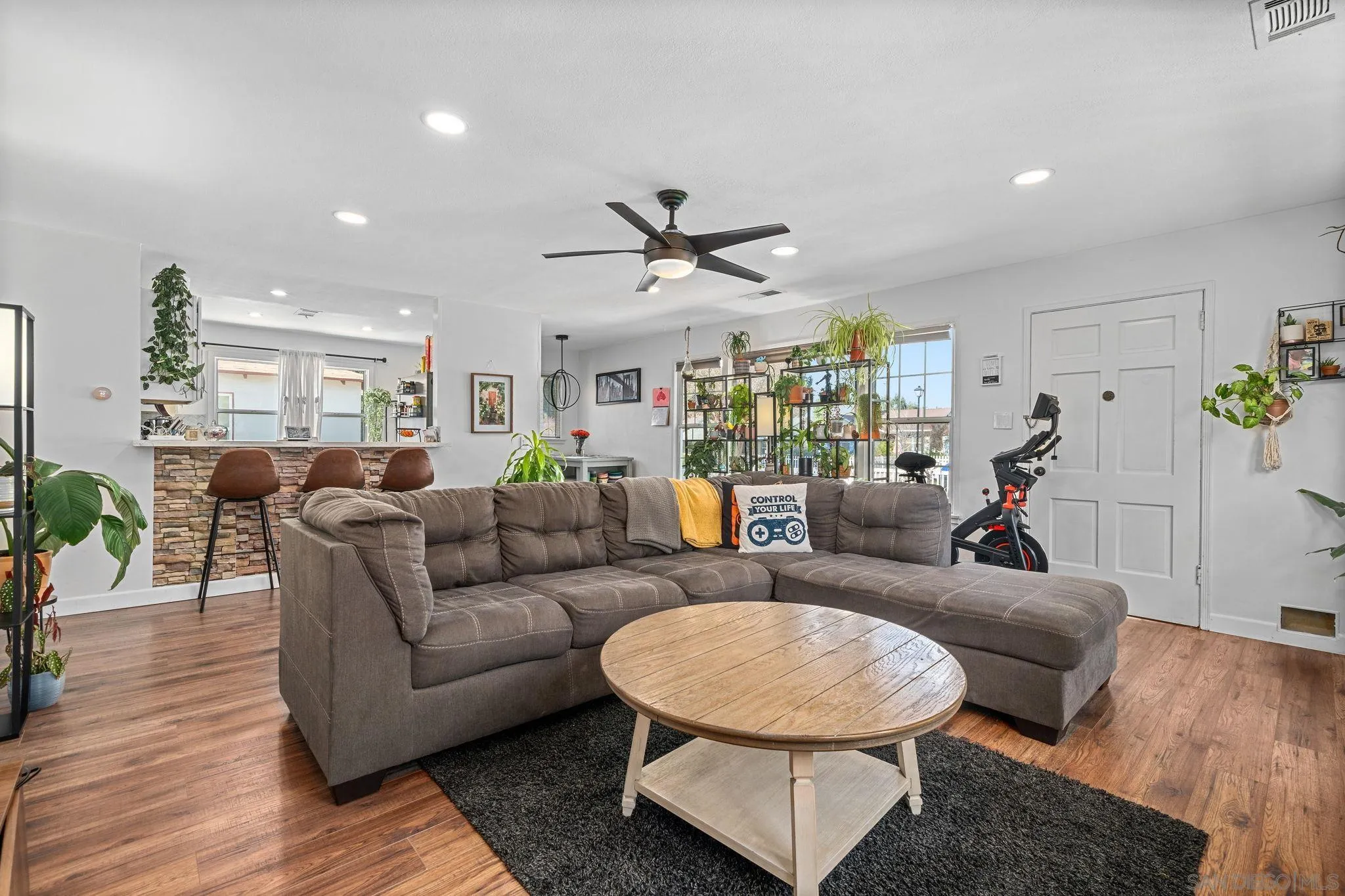 4544 Edgewood Place Riverside, CA 92506 - Photo 4 of 29 a living room with furniture and wooden floor