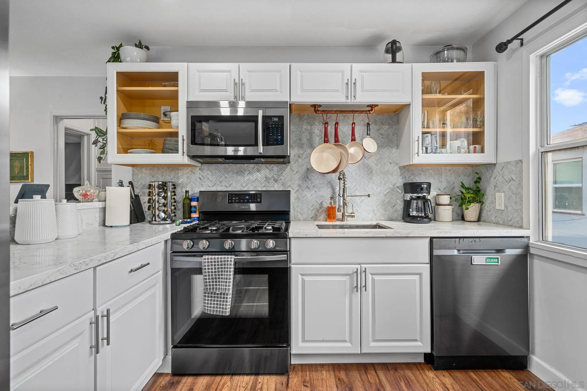 4544 Edgewood Place Riverside, CA 92506 - Photo 6 of 29 a kitchen with stainless steel appliances granite countertop a stove a sink and a microwave