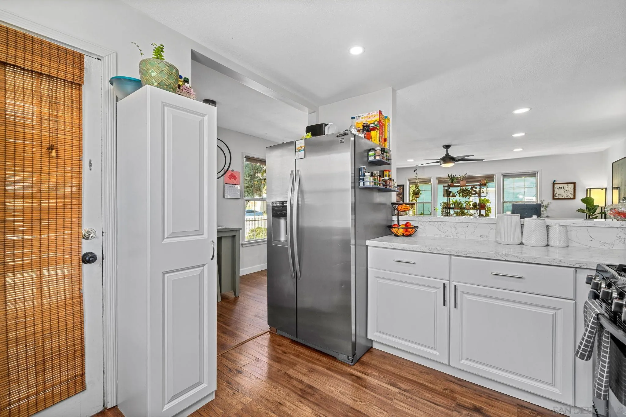 4544 Edgewood Place Riverside, CA 92506 - Photo 7 of 29 a kitchen with stainless steel appliances granite countertop a refrigerator and a sink