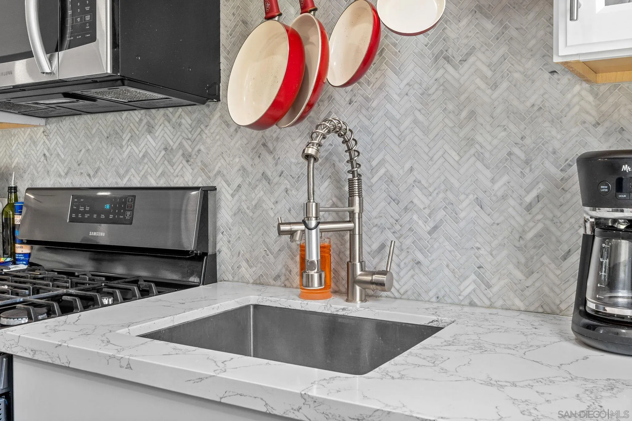 4544 Edgewood Place Riverside, CA 92506 - Photo 8 of 29 a kitchen with a sink and a stove