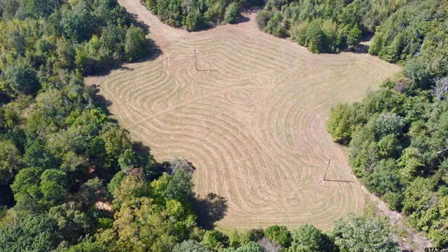 a view of white house with a yard