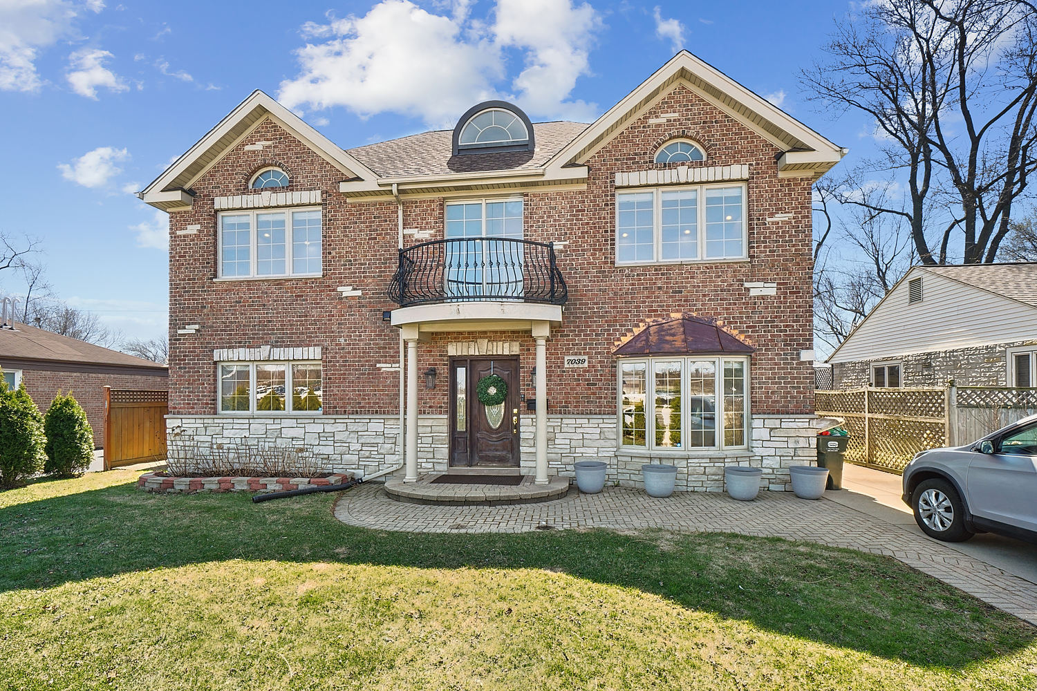 a front view of a house with a yard