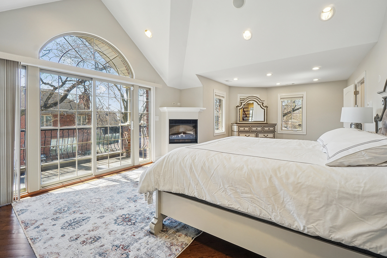7039 Simpson Street Morton Grove, IL 60053 - Photo 14 of 24 a spacious bedroom with a large bed and a large window