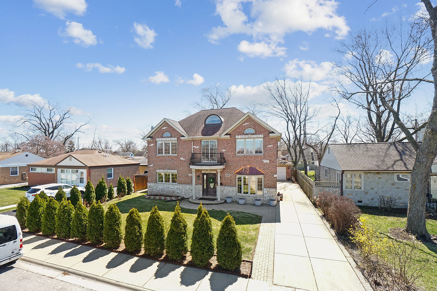 7039 Simpson Street Morton Grove, IL 60053 - Photo 2 of 24 a front view of a house with a yard