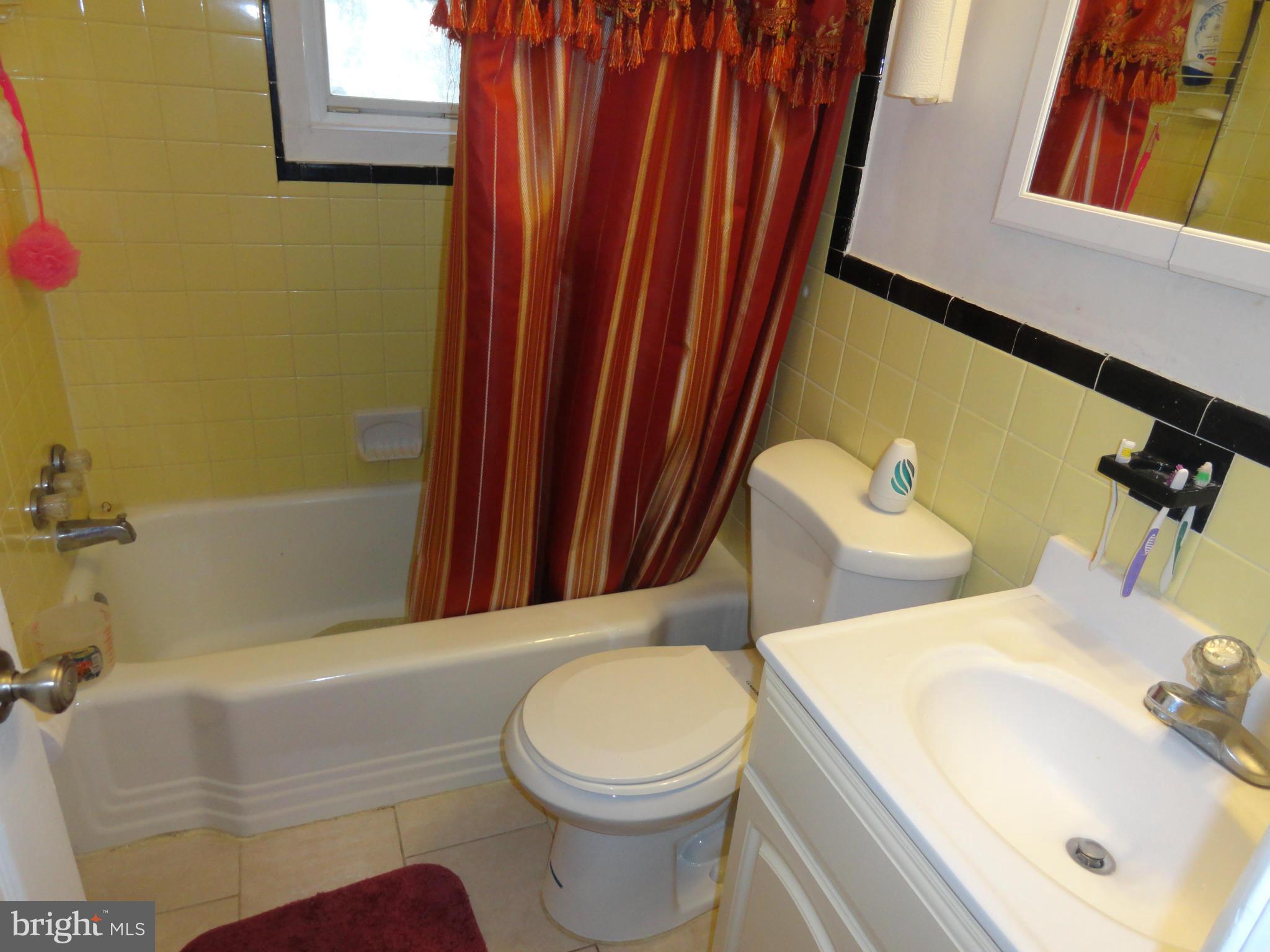 3400 Harrell Street Silver Spring, MD 20906 - Photo 22 of 22 a bathroom with a sink and a mirror