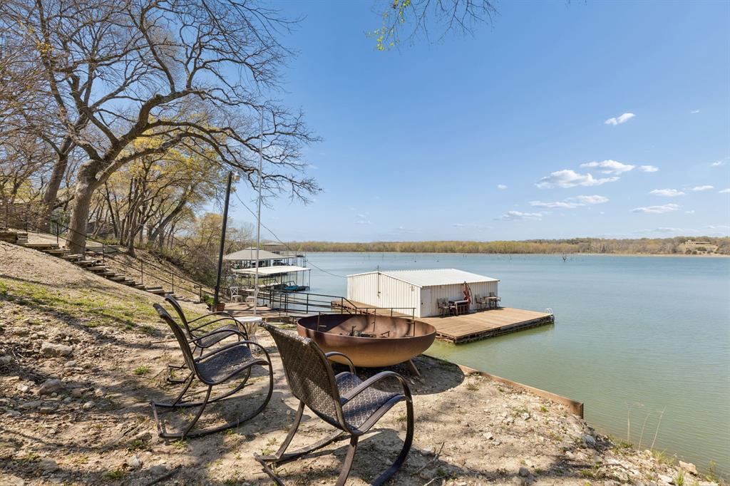 41 White Oak Road Gainesville, TX 76240 - Photo 35 of 40 a view of a chairs and table on the terrace