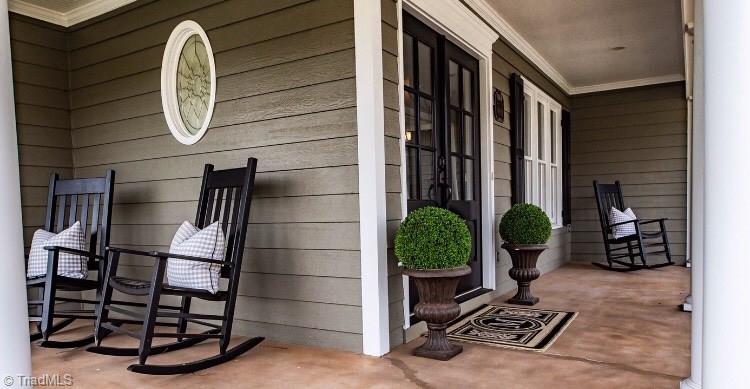 4901 Hackamore Road Greensboro, NC 27410 - Photo 2 of 21 Rocking chair worthy, wrap-around front porch makes this chic farmhouse irresistible!