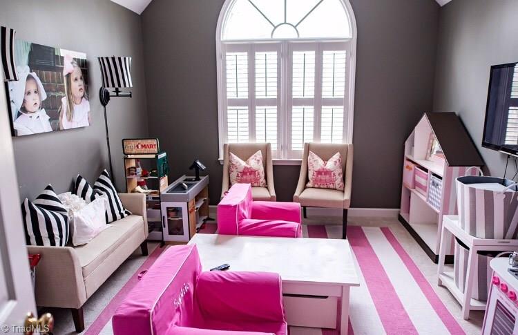 4901 Hackamore Road Greensboro, NC 27410 - Photo 15 of 21 Currently used as a delightful playroom, this fourth bedroom could be an at home office or guest bedroom.