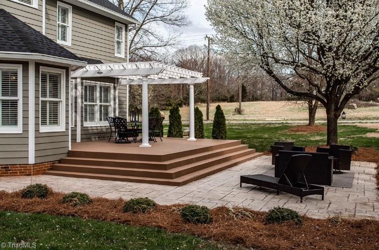 4901 Hackamore Road Greensboro, NC 27410 - Photo 20 of 21 This new pergola and custom patio await for summertime enjoyment.
