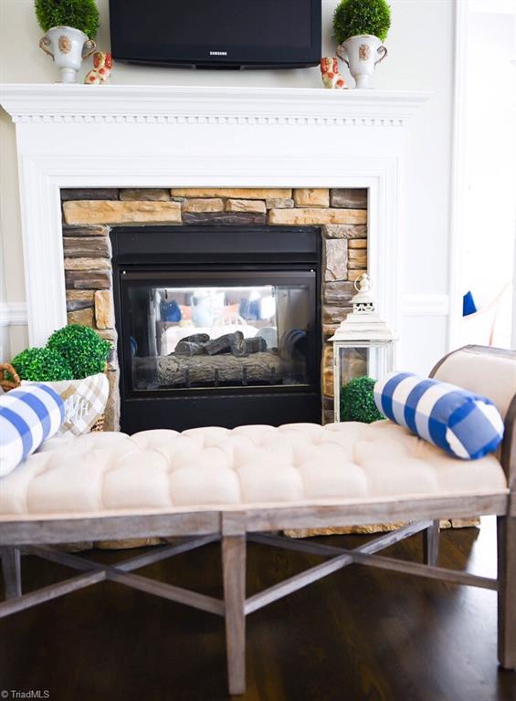 4901 Hackamore Road Greensboro, NC 27410 - Photo 6 of 21 Double sided fireplace as seen from the keeping room.
