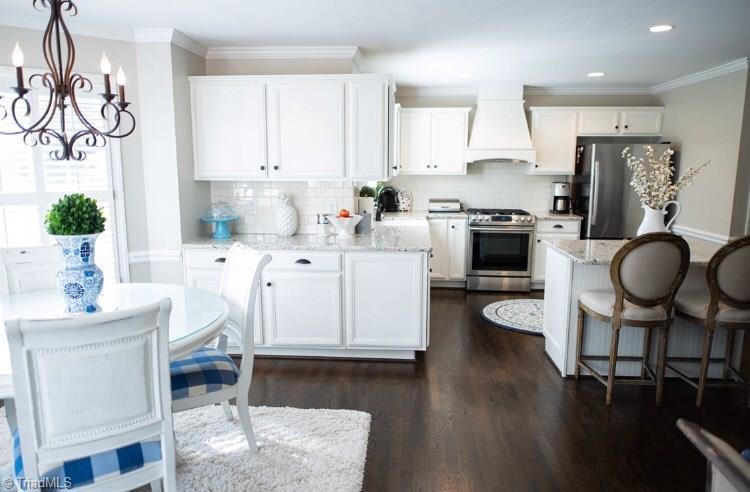 4901 Hackamore Road Greensboro, NC 27410 - Photo 7 of 21 Plenty of space to prep/serve/entertain in this elegant, remodeled kitchen, suited for today's buyer.