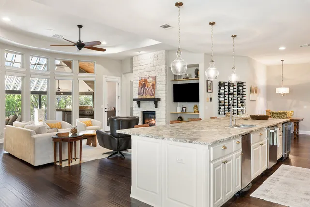 a open kitchen with stainless steel appliances kitchen island a large island in the center
