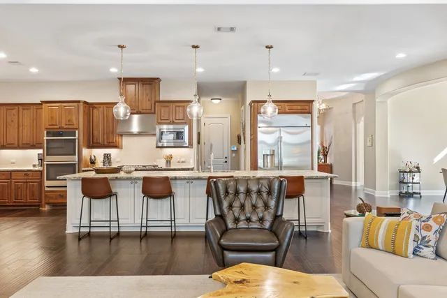 a dining room with furniture and wooden floor