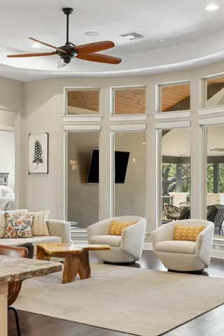 a living room with furniture and a large window