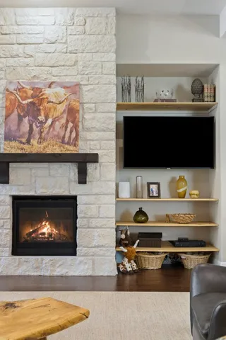 a living room with furniture and a fireplace