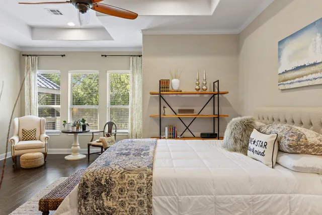 a bedroom with a bed and a couch