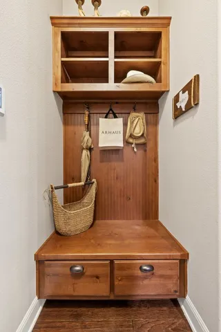 a living room with a stove and a refrigerator