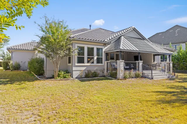 a front view of a house with swimming pool